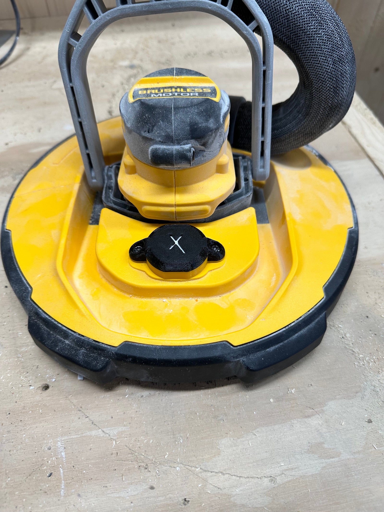DeWalt drywall sander AirTag mount side view