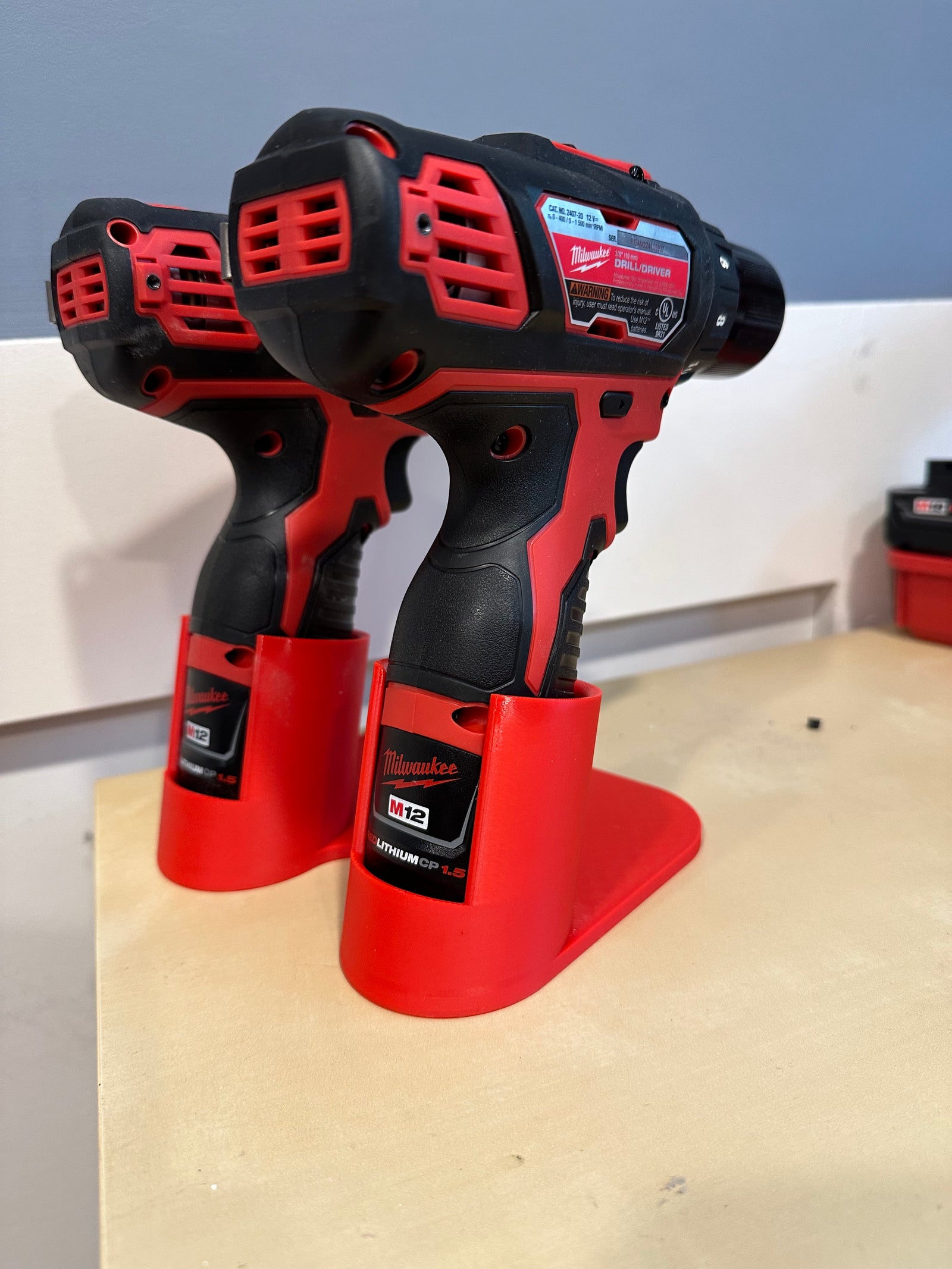 Milwaukee M12 drill and driver tabletop holder close-up detail