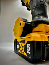 DeWalt AirTag holder mounted on DeWalt power tool