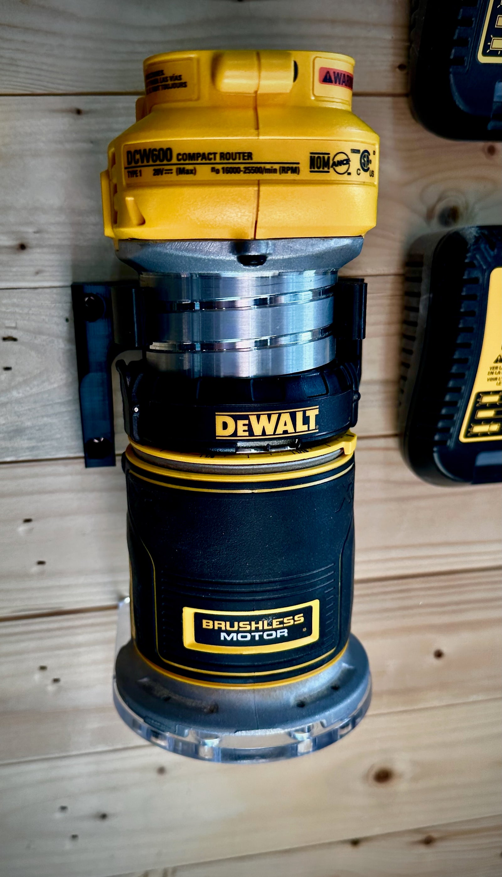 DeWalt DCW600 router holder installed on workshop wall