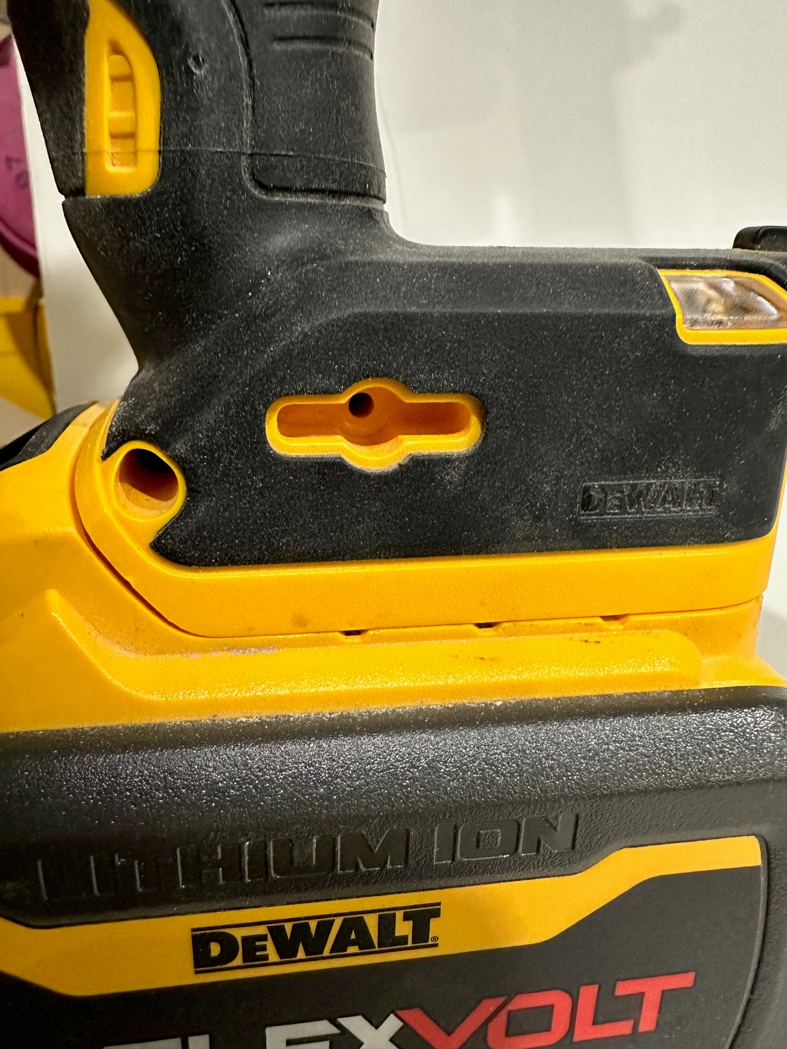 DeWalt 20V stapler AirTag mount close-up detail
