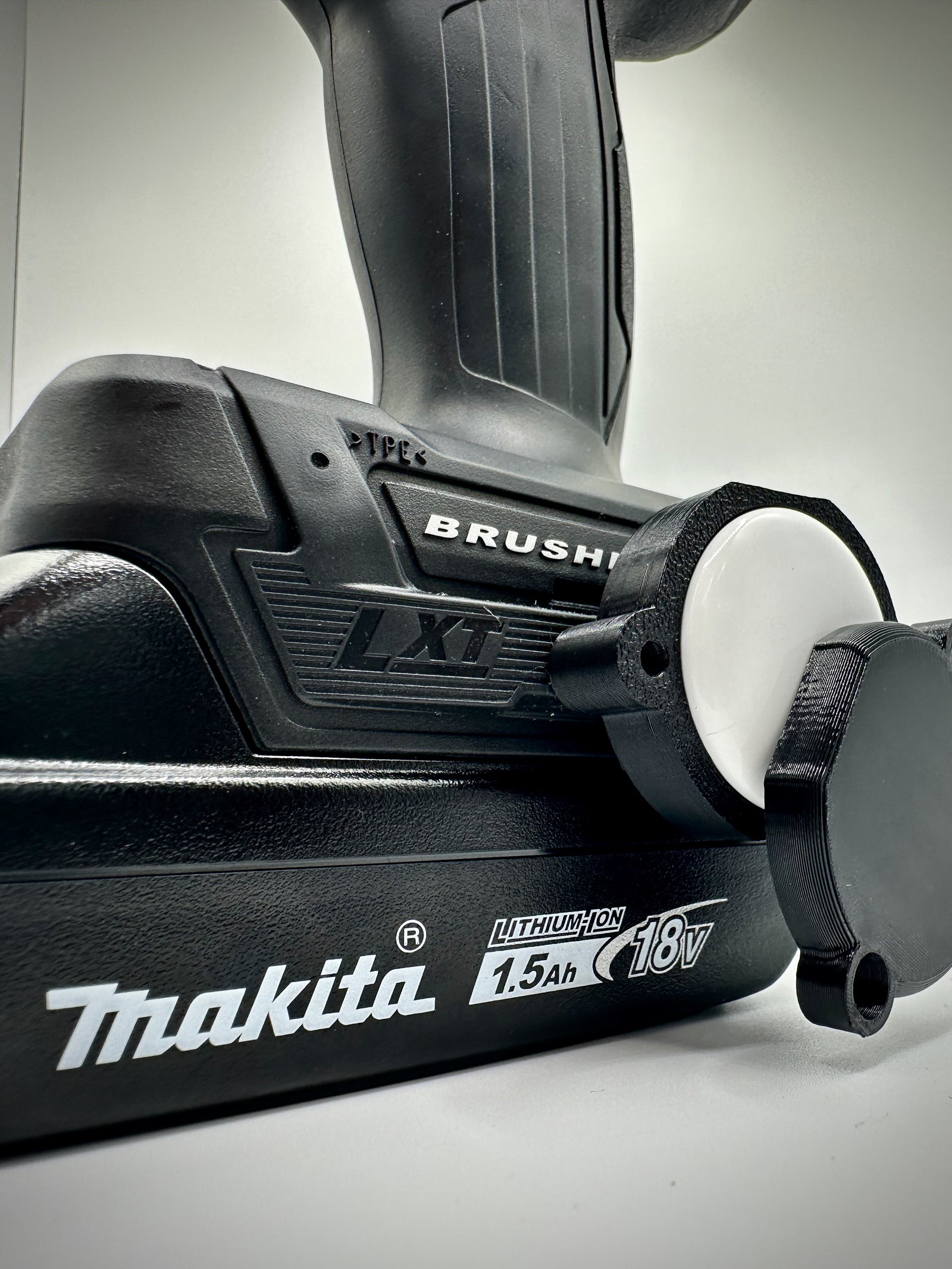 Makita AirTag holder 3D printed teal and black front view